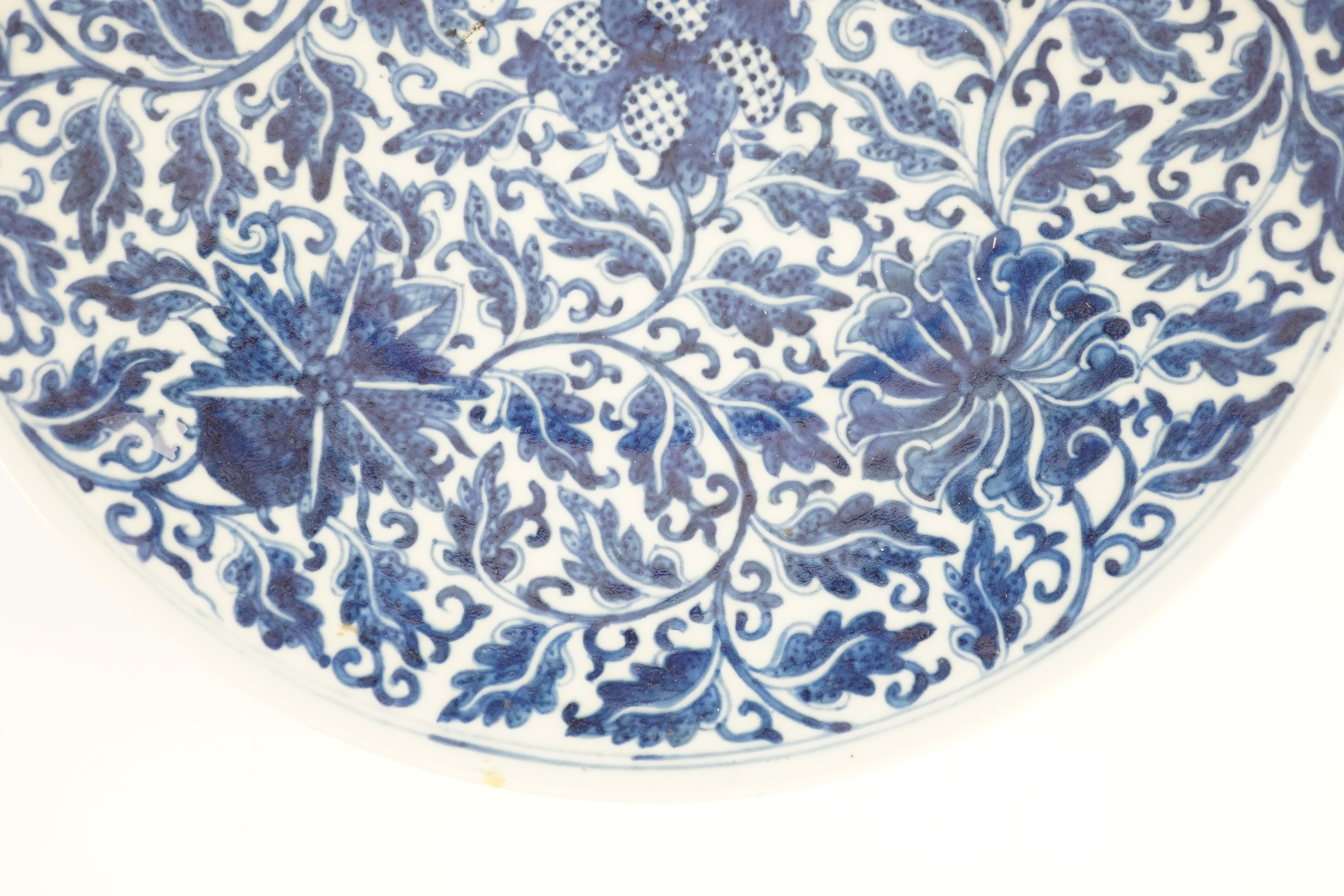 A Chinese blue and white dish, Kangxi mark, 19th century, 34.5cm diameter